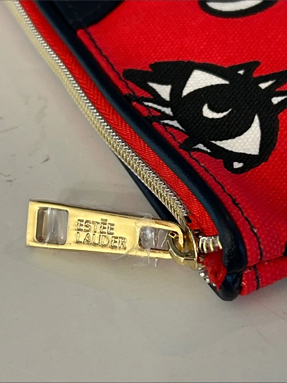 Estée Lauder Red Cosmetic Pouch with beasts, Mickey heads and cute graphics